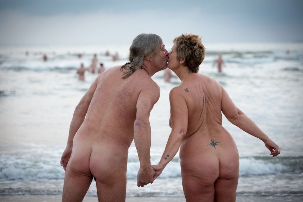 nudists kissing on the beach